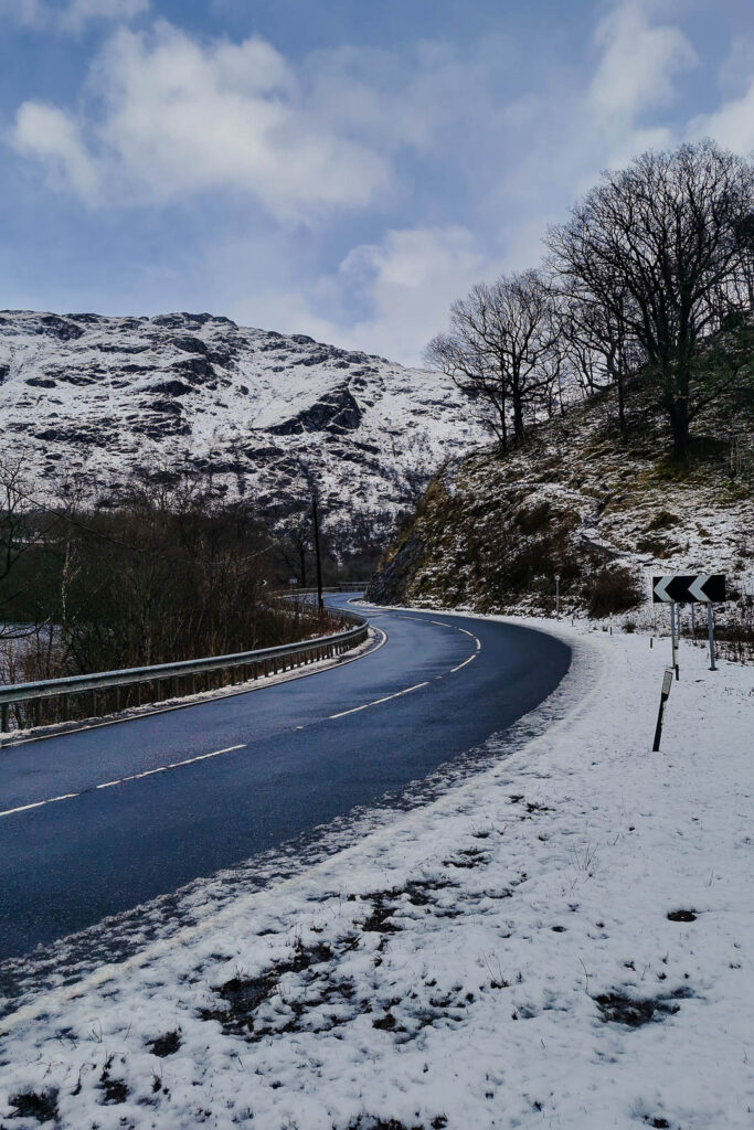 a winding road on loch lomond in scotland