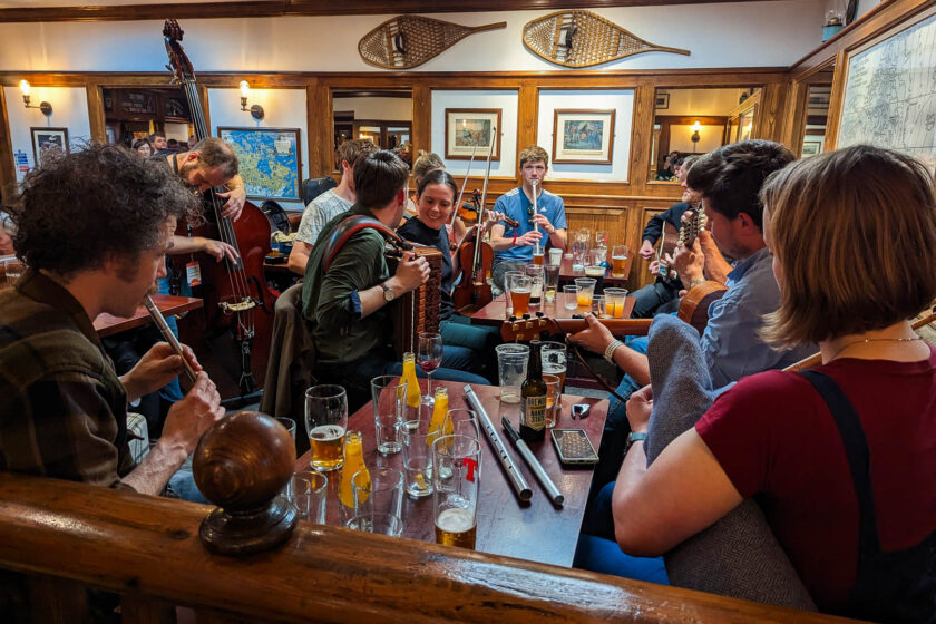 Musicians playing at a pub session at the Orkney Folk Festival in Stromness