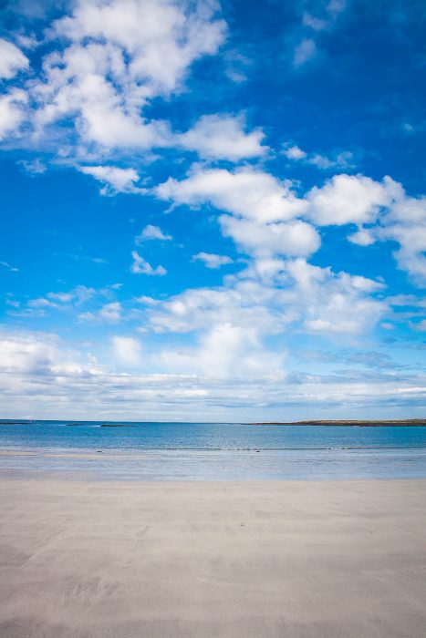sandy beach and blue sky on oransay