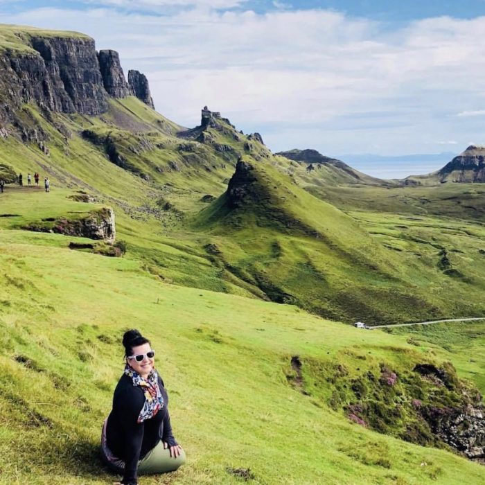 Author Sara Bublitz - A woman sitting in the mountains in Scotland