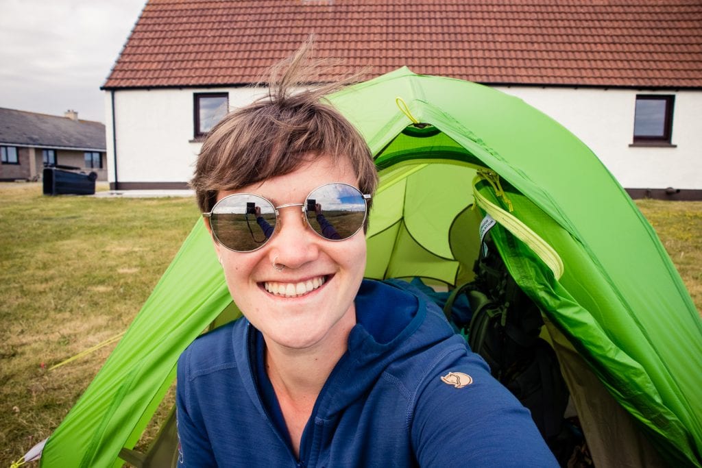 Girl in front of her tent on the Shell Bay campsite on Benbecula.