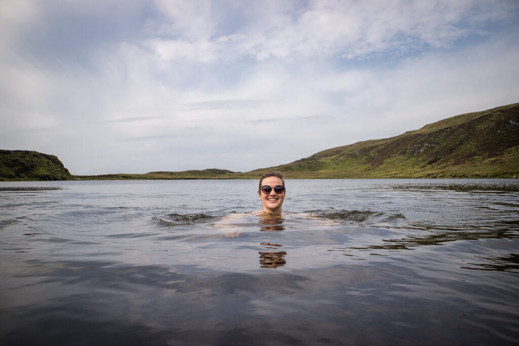 a woman wild swimming on the isle of mull