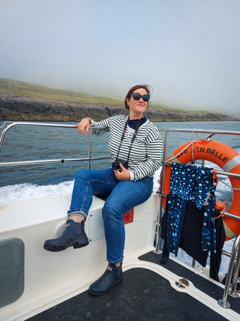 kathi kamleitner sitting at the back of a boat