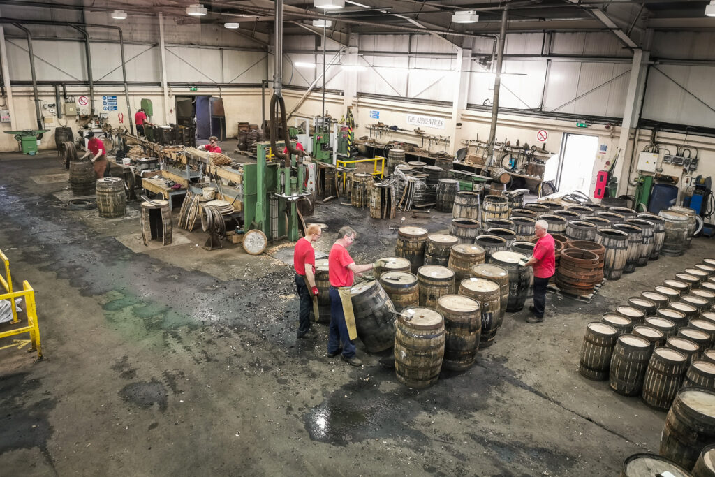 Coopers fixing whisky casks at the Speyside Cooperage in Scotland