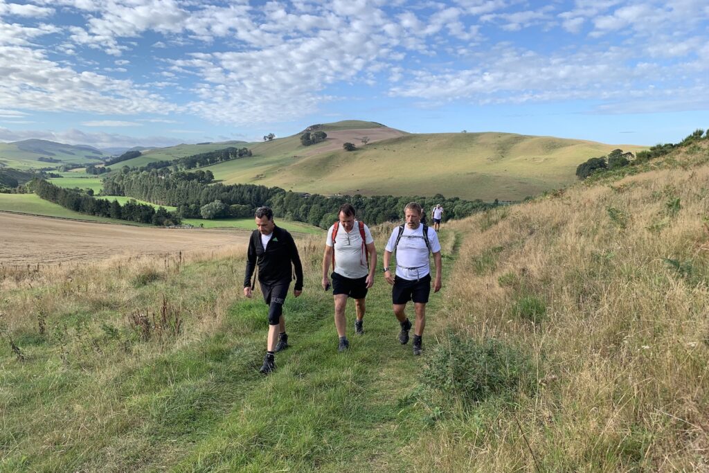 Three hikers walking to Morebattle in the Scottish Borders