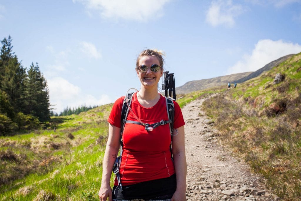 A woman in hiking clothes on the West Highland Way.