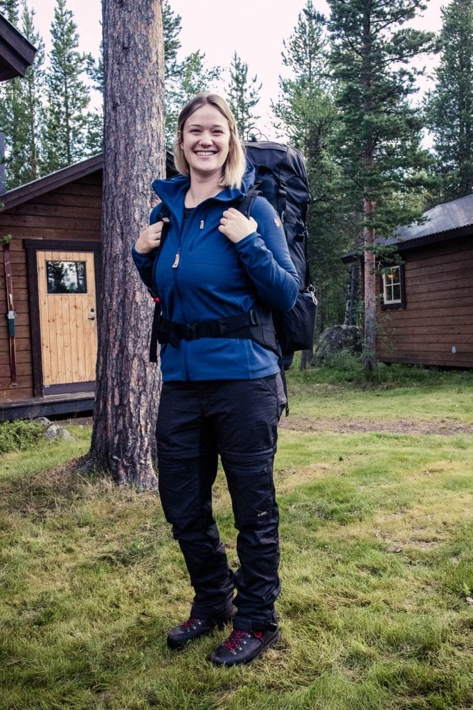 Girl carrying the Fjallraven Abisko 65 L backpack. - The best trekking backpacks & their must-have features